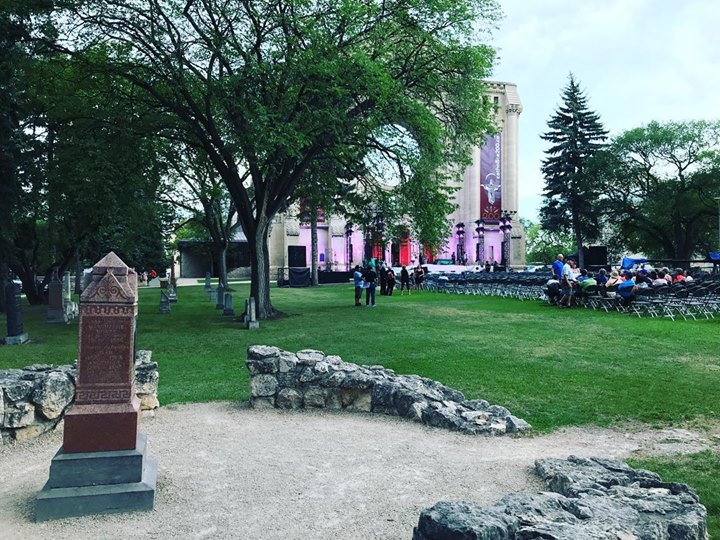 View from the tomb of Louis Riel, of the stage on the front steps of Winnipeg’s St. Boniface Cathedral. Tonight there will be a gala concert celebrating the Cathedral’s 200th anniversary, featuring top performers from Canada. There will be a portion of the show broadcast from Riel’s tomb. Livestream here, starts at 8 pm CST: https://saltandlighttv.org/live/